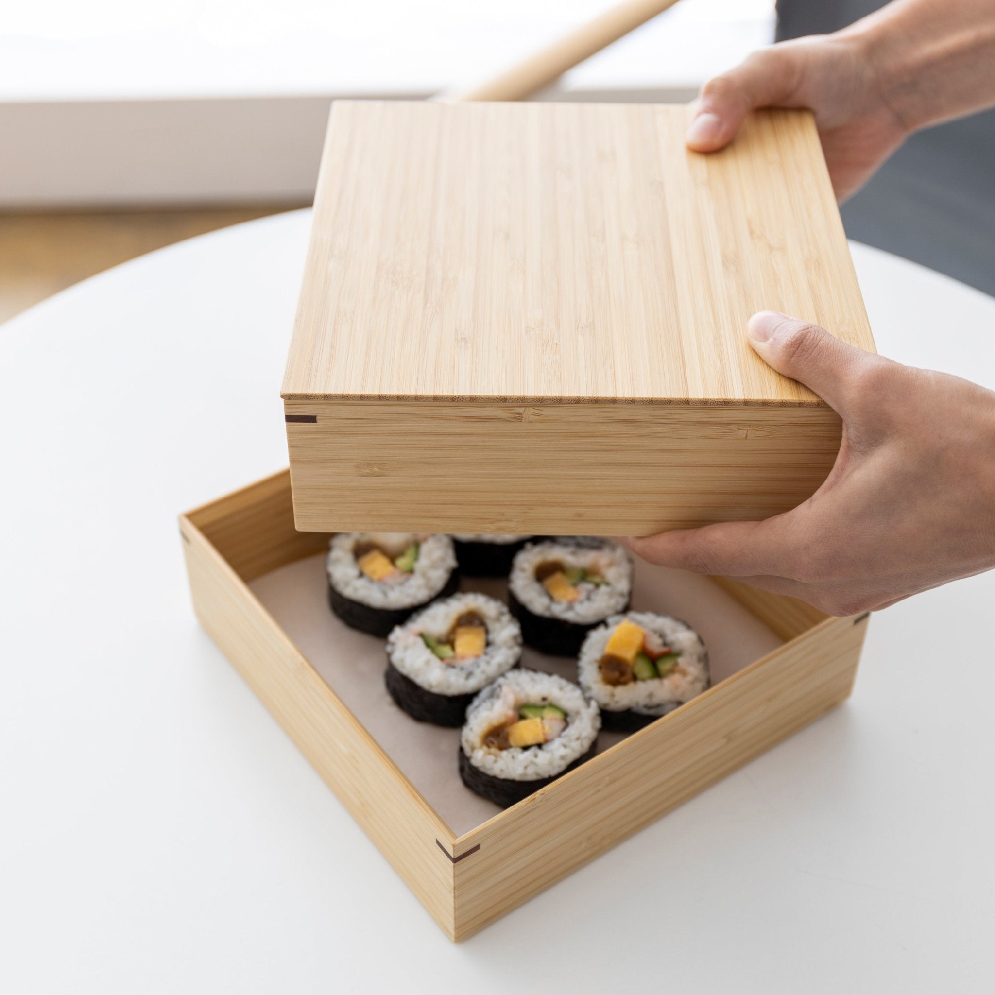 http://shop.tortoisegeneralstore.com/cdn/shop/products/kosuga-bamboo-tiered-square-lunch-box-set-687601.jpg?v=1659193820