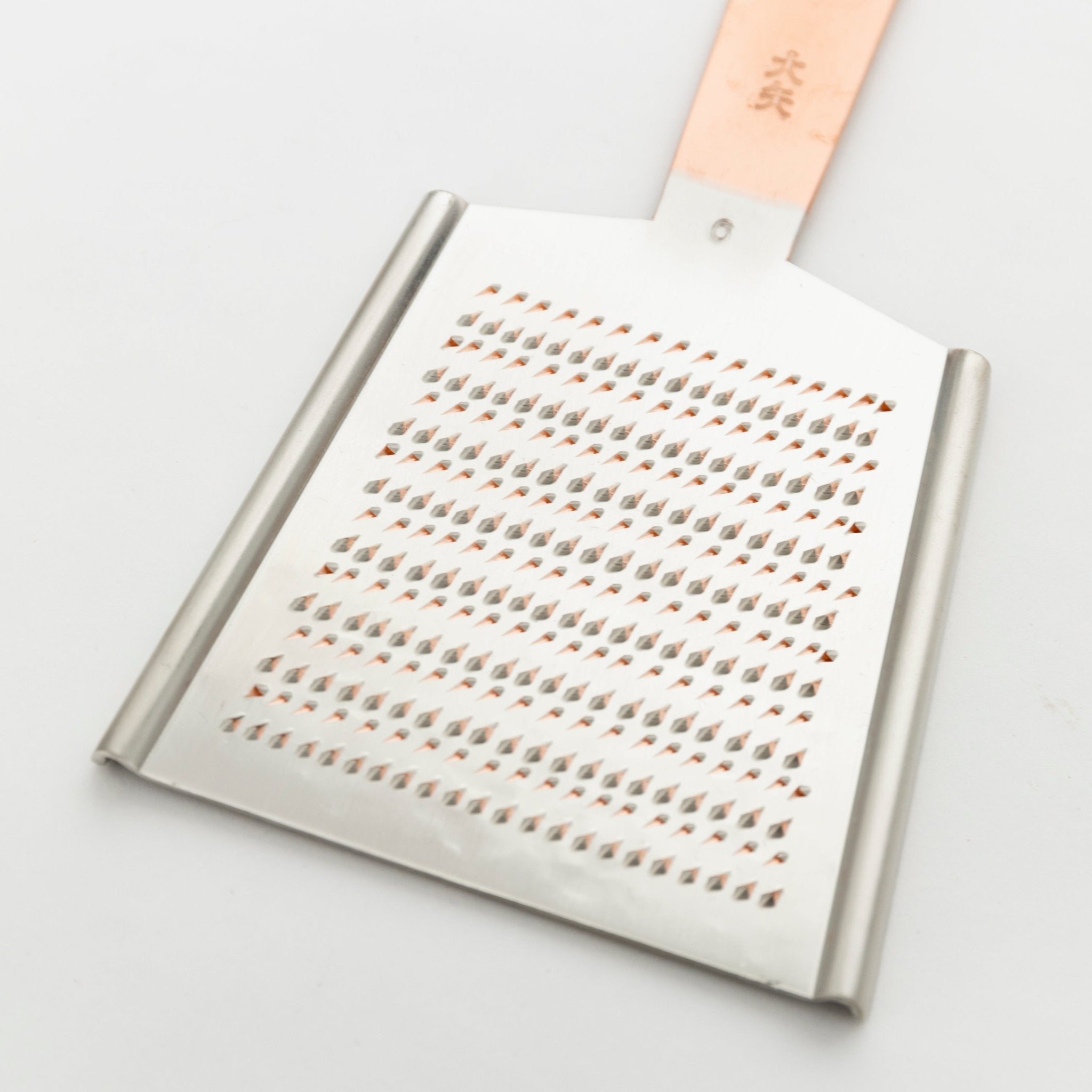 http://shop.tortoisegeneralstore.com/cdn/shop/products/ooya-large-grater-544119.jpg?v=1654900586