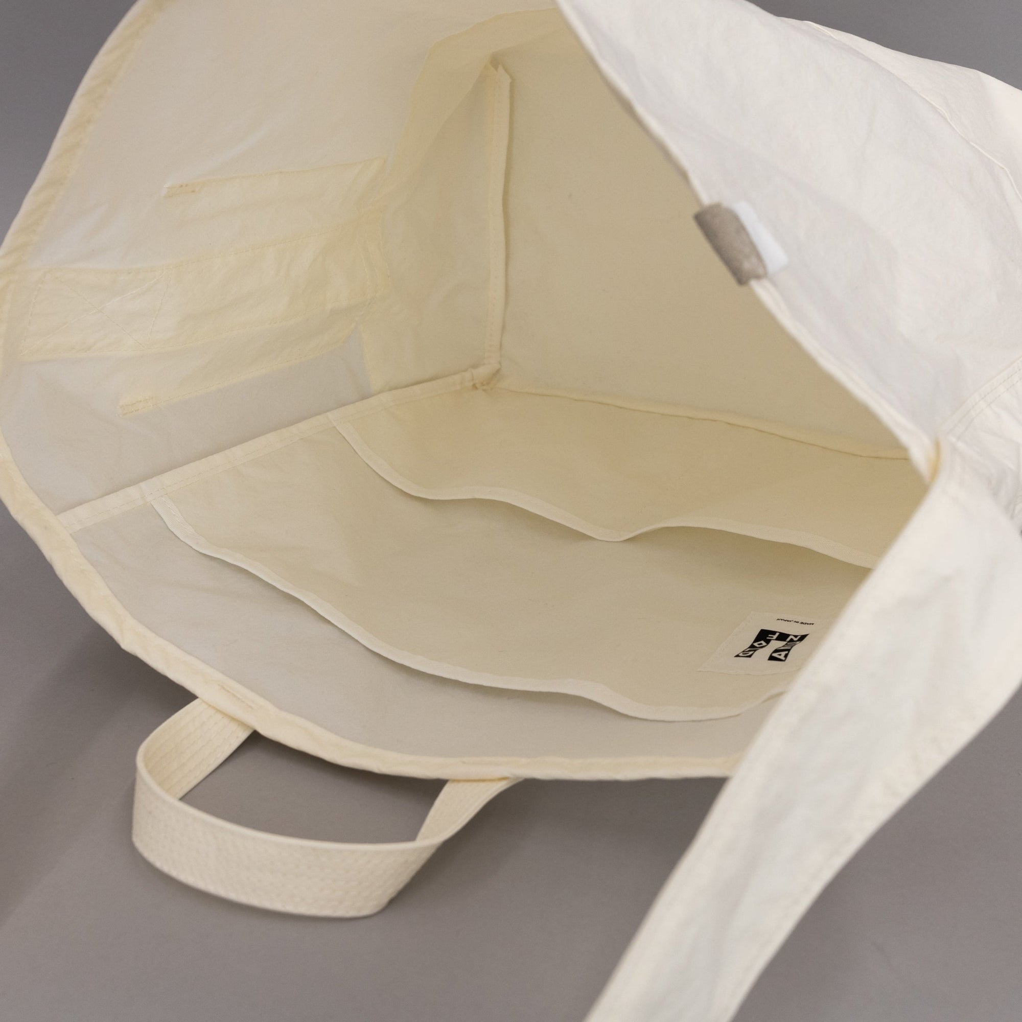 ANUNFOLD Side Pocket Tote Bag - White | Tortoise General Store